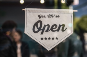 Sign reading "Yes, We're Open"