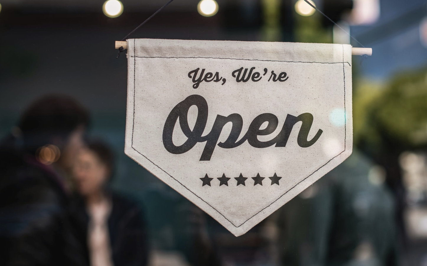 Sign reading "Yes, We're Open"