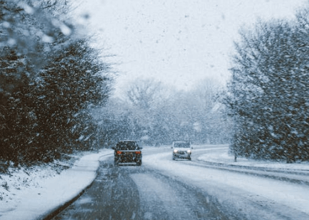 two cars on a snow-covered road