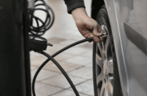 Man inflating a tire - tire inflation services for low tire pressure