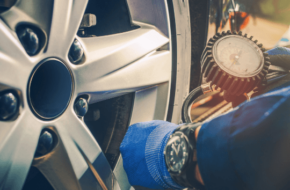 Mechanic checking tire pressure