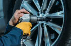 Local mechanic putting a new tire on a vehicle