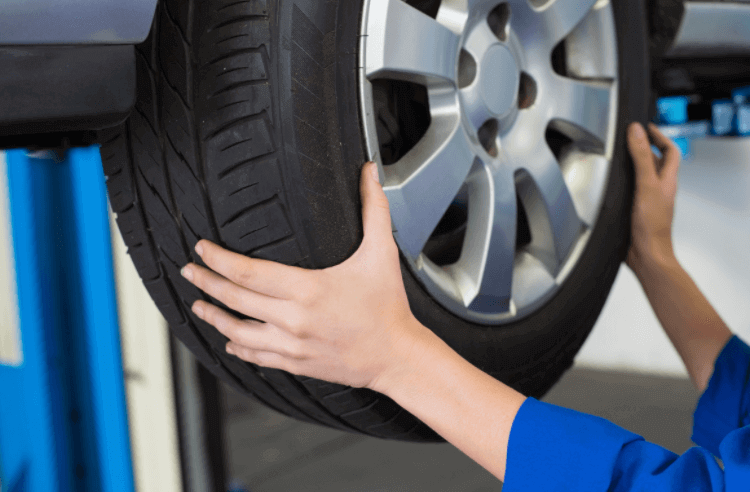 Mechanic balancing a tire