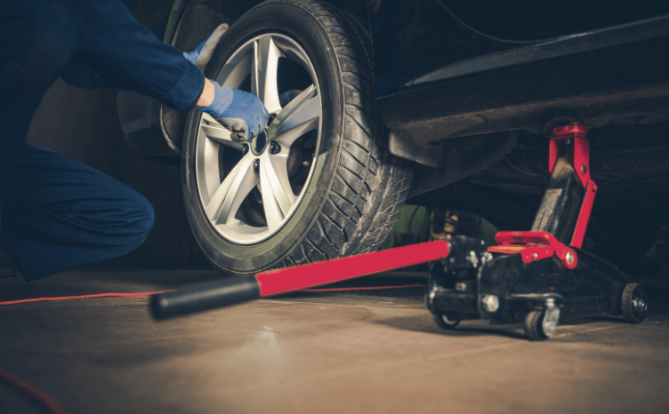 Mechanic completing a tire rotation