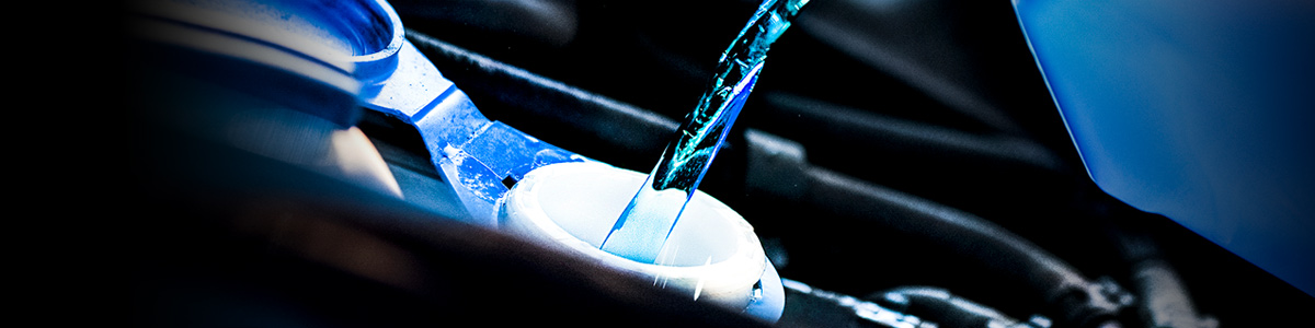 antifreeze being poured into a reservoir