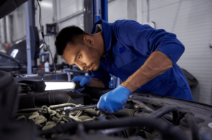 Mechanic Completing Engine and Transmission Service