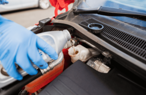 Mechanic completing a brake fluid flush