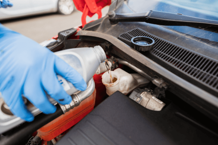 Mechanic completing a brake fluid flush