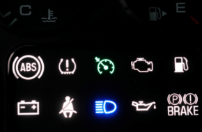 A dashboard lit up with warning lights