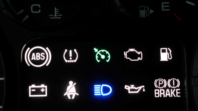 A dashboard lit up with warning lights