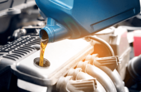 Mechanic pouring oil into the engine