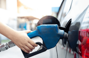 person refueling at a gas pump