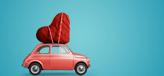 Valentine's Day car carrying oversized heart