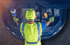 Car mechanic doing engine work