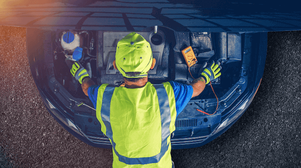 Car mechanic doing engine work