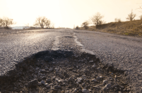 A pothole on an open road