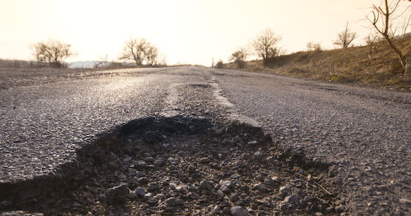 A pothole on an open road