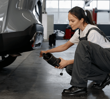 Woman performs car emissions testing