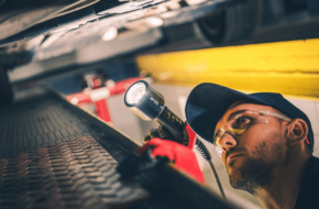 mechanic performs a pre-purchase vehicle inspection