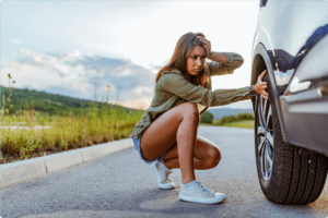 Woman with a broken down car