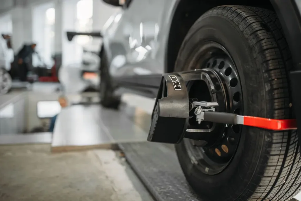 Car wheel alignment check in auto repair shop